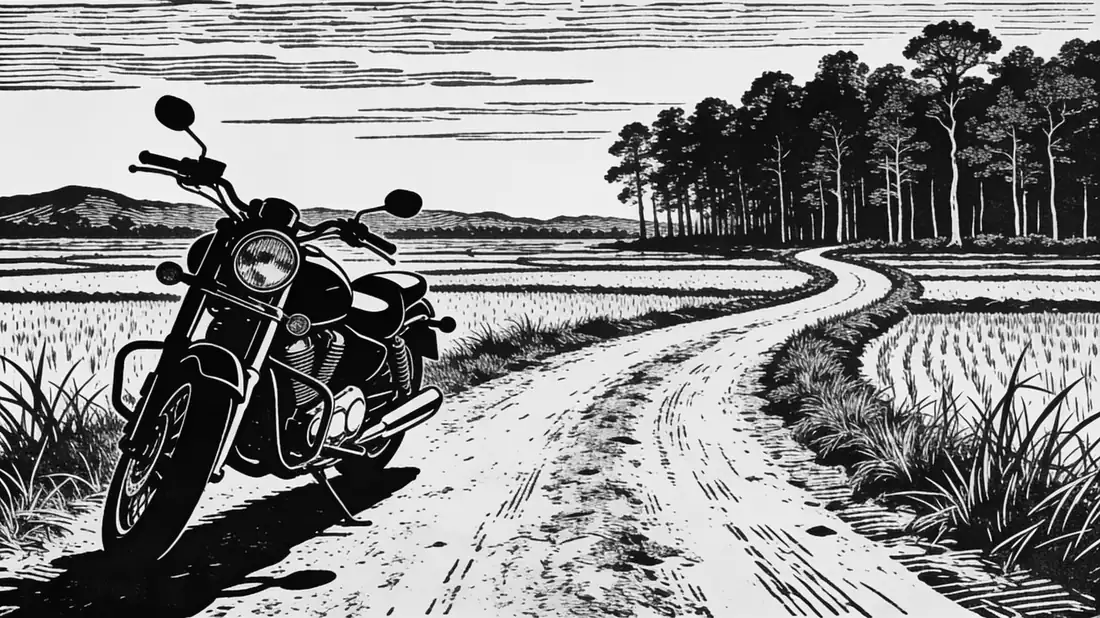 Engraved illustration of a cruiser motorcycle parked at the roadside, a dirt track curving through paddy fields toward a forest treeline.